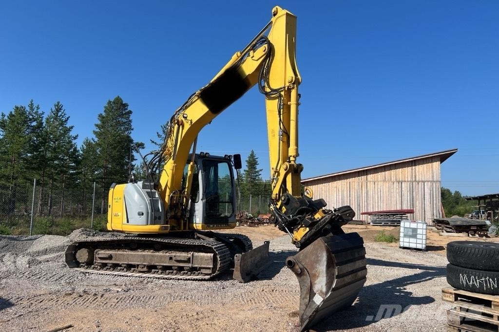 New Holland E 135 B Pásová rýpadla