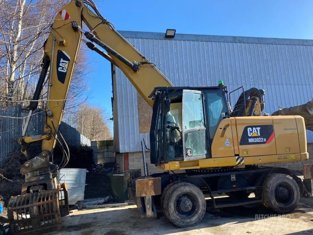 CAT MH3022 Stroje pro manipulaci s odpadem