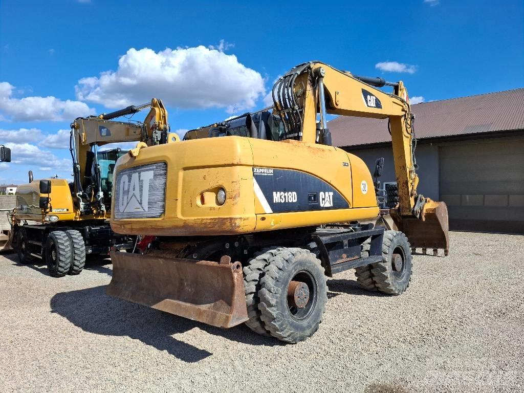 CAT 318 Kolová rýpadla