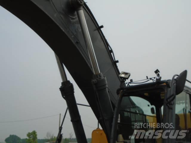 John Deere 450 DLC Pásová rýpadla