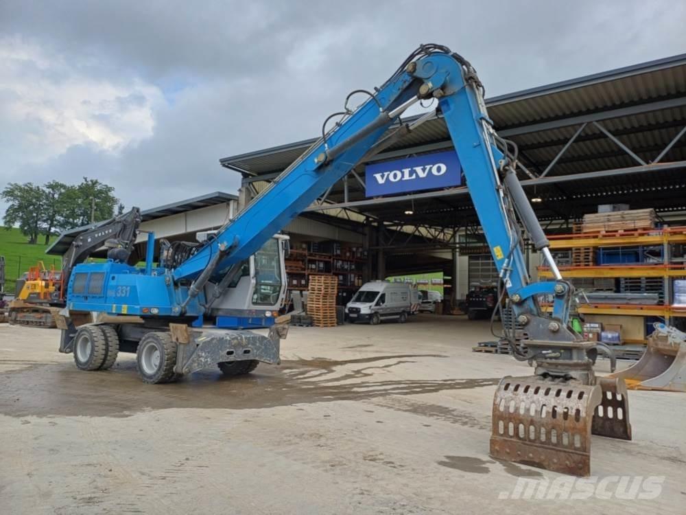 Fuchs MHL 331 Stroje pro manipulaci s odpadem