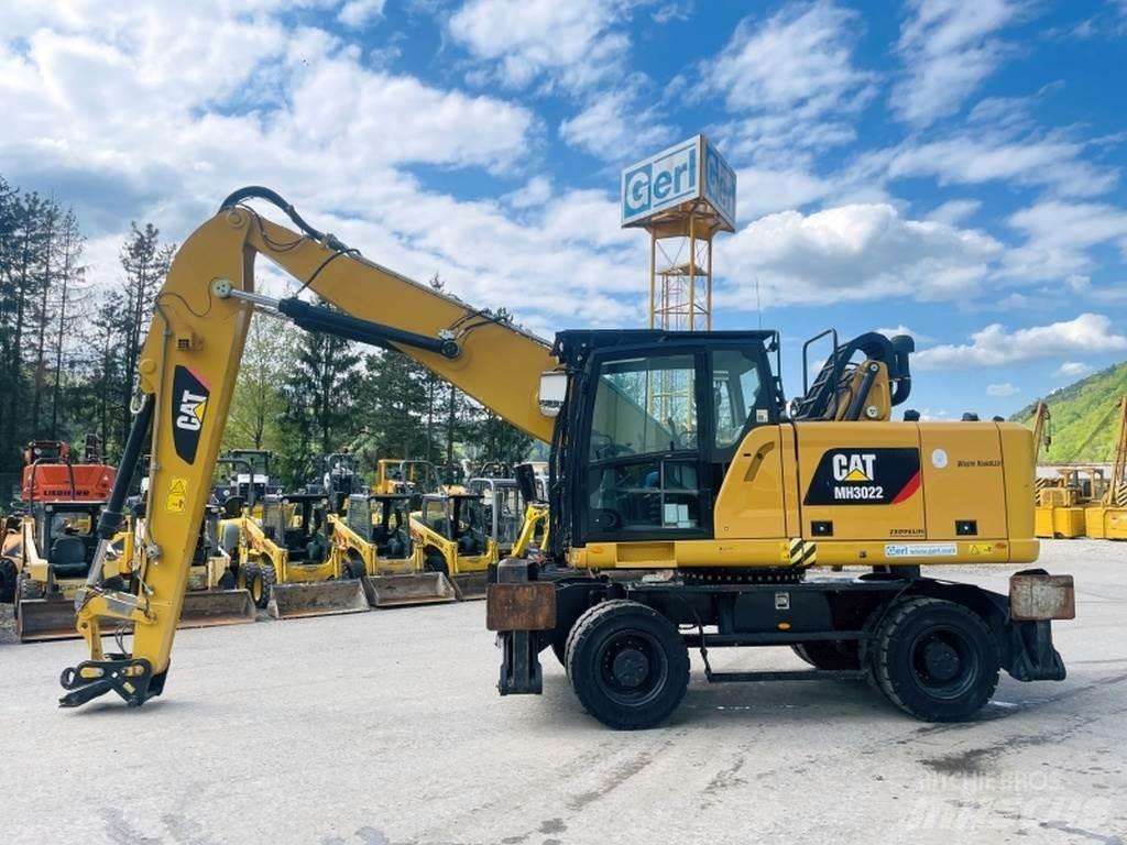 CAT MH3022 Stroje pro manipulaci s odpadem