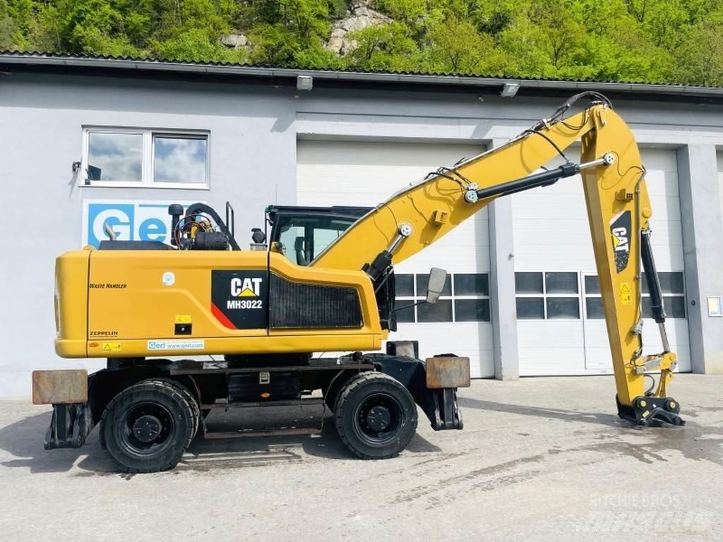 CAT MH3022 Stroje pro manipulaci s odpadem
