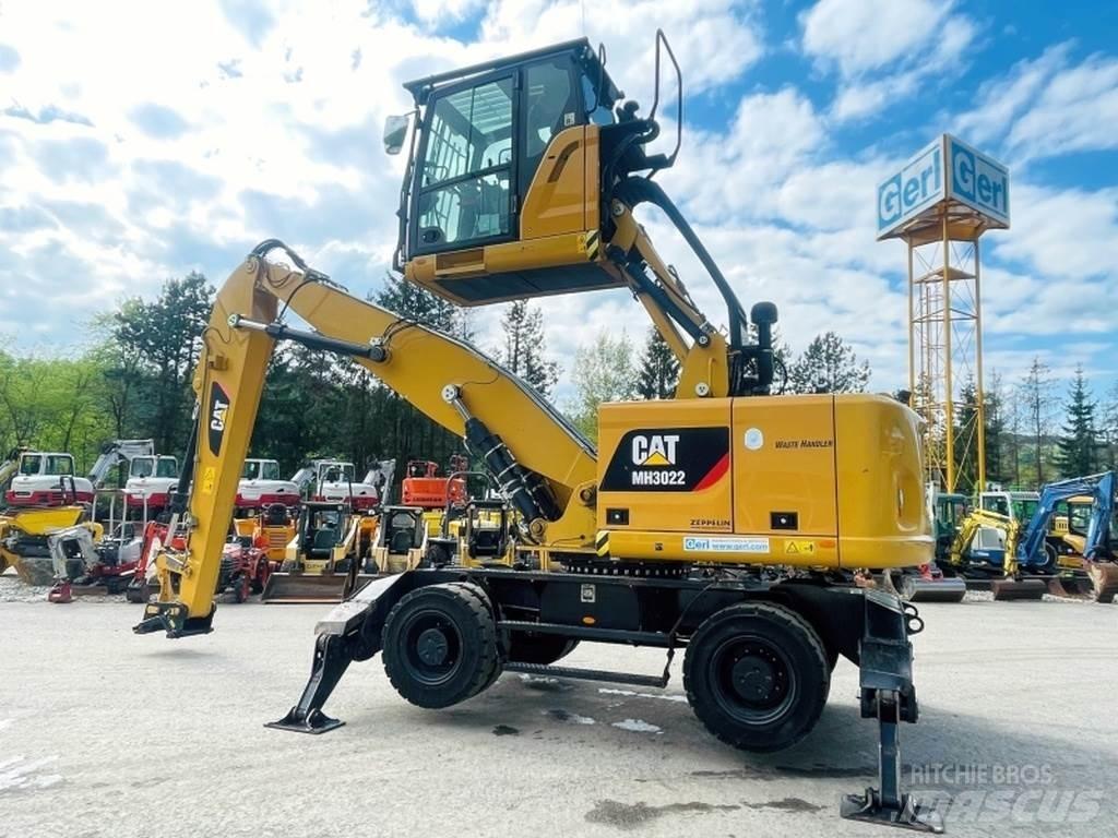 CAT MH3022 Stroje pro manipulaci s odpadem