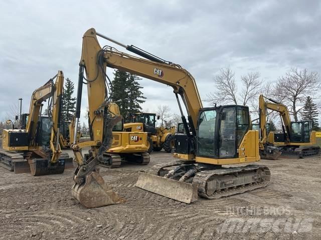 CAT 310 Pásová rýpadla