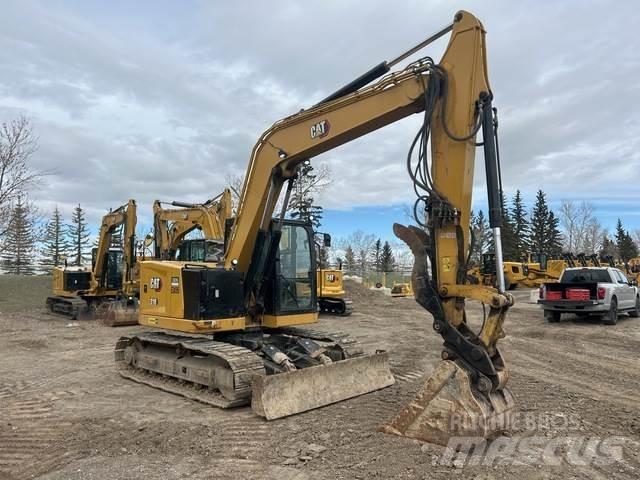 CAT 310 Pásová rýpadla