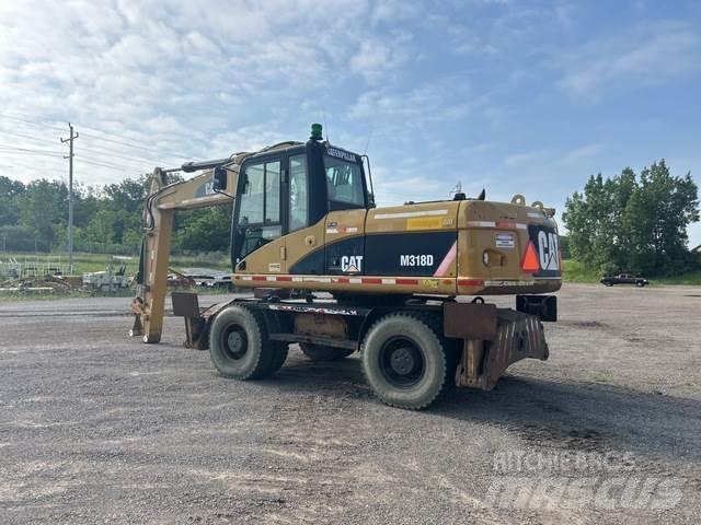 CAT M318D Kolová rýpadla