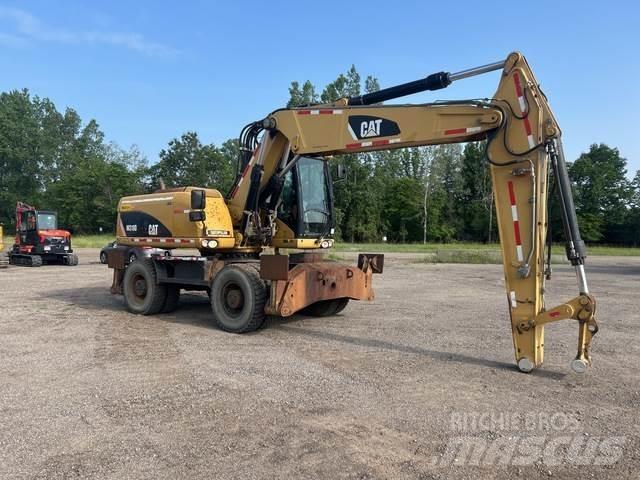 CAT M318D Kolová rýpadla