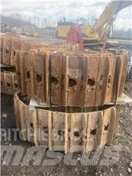 CAT 325 Pásy, řetězy a podvozek