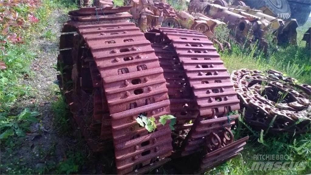 CAT 953 Pásy, řetězy a podvozek