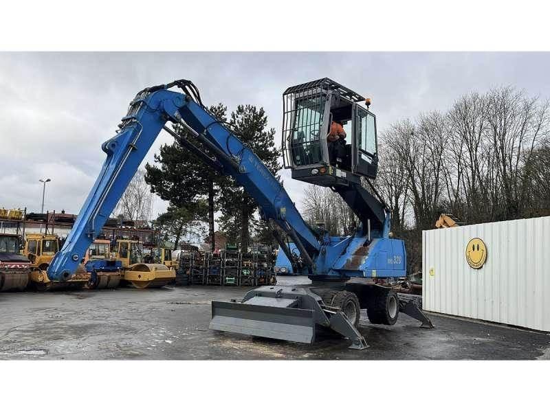 Fuchs MHL320 Stroje pro manipulaci s odpadem