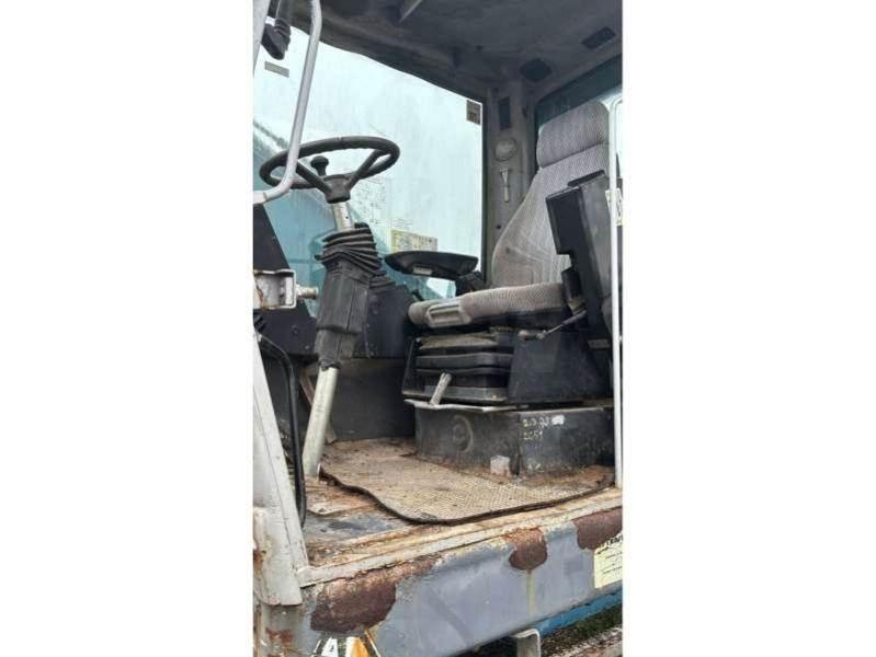 Fuchs MHL320 Stroje pro manipulaci s odpadem